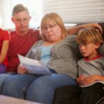family sitting on couch